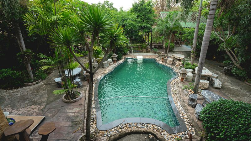 Luxurious mansion with beautiful gardens and a resort-like atmosphere, located on the Chak Kho-Nong Kham road.